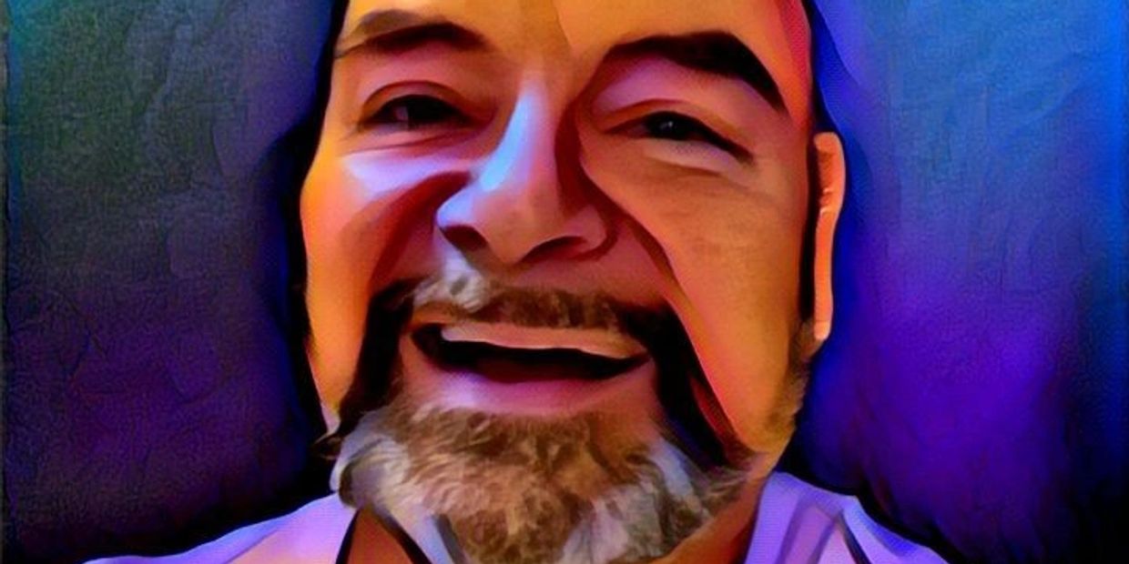 Digital portrait of a smiling man with a beard against a colorful background.