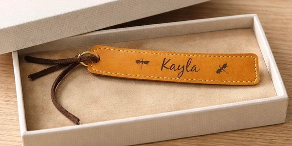 Leather keychain with the name Kayla engraved, presented in a gift box.