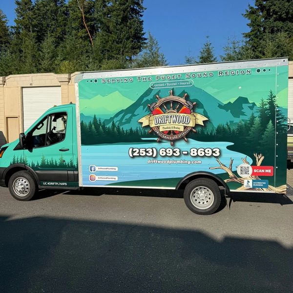 Turquoise Driftwood Plumbing & Heating service truck with company branding