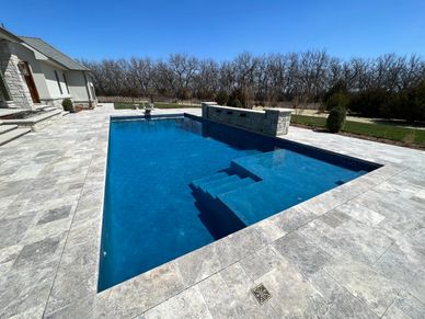 Luxury outdoor swimming pool with clear blue water and modern design