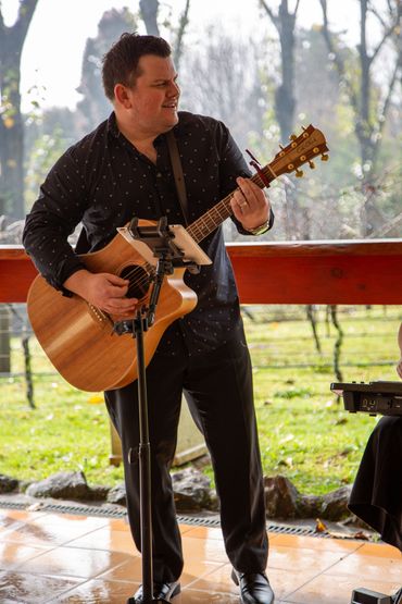Musician enjoying playing at a winery wedding near Warwick