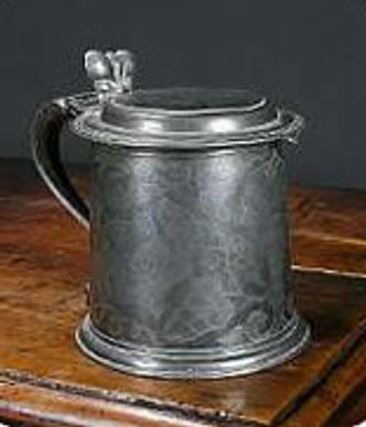 Photograph of a pewter lidded mug.