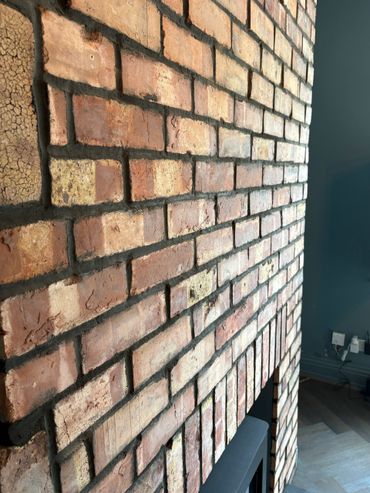 Close-up of a rustic brick wall with visible mortar.