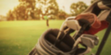 Golf clubs and green blurred due to a cataract before eye surgery