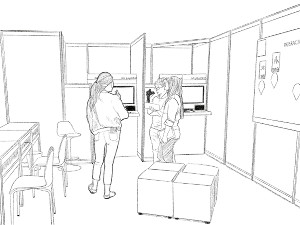 Three women interacting at a tech exhibit booth.