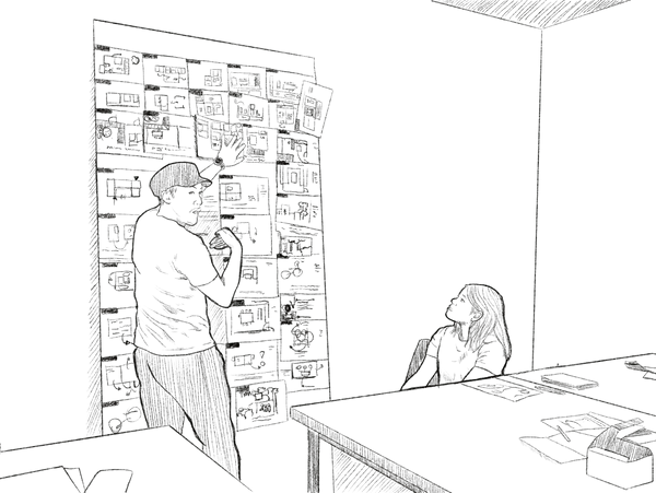 Man presenting ideas on a board to a seated woman in a casual meeting.