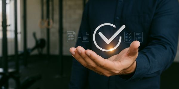 Person holding a glowing checkmark icon symbolizing task completion.