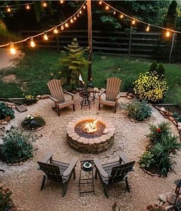Cozy backyard fire pit area with string lights and Adirondack chairs.