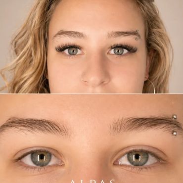 Natural full set eyelash extensions on blonde client with green eyes