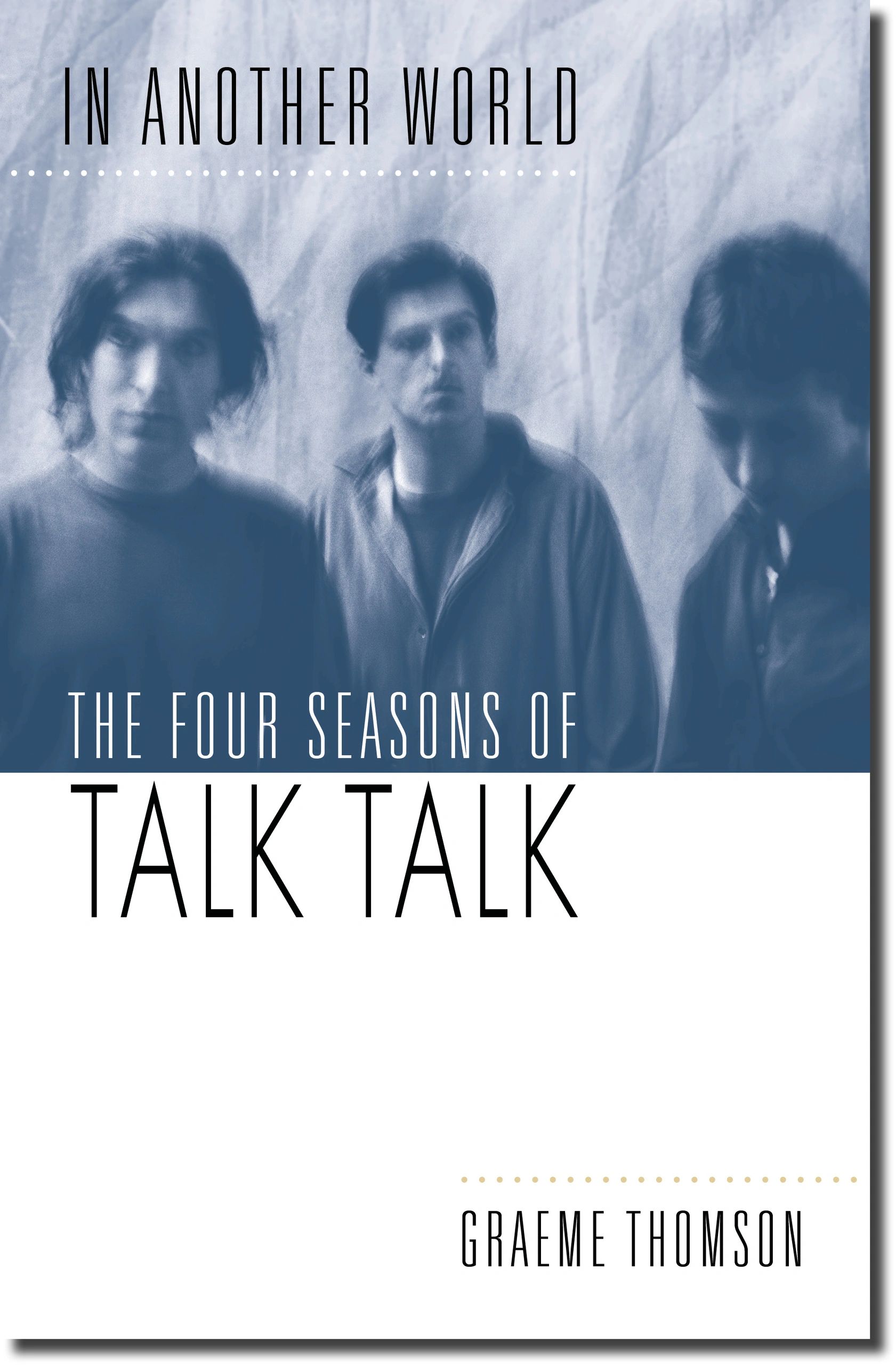 Blurred blue-toned image of three men on a book cover titled 'In Another World'.