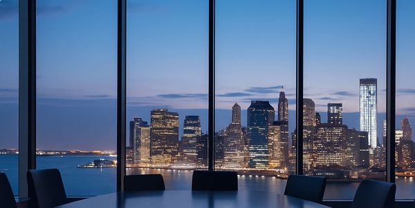 Modern boardroom with panoramic city skyline view, representing collaboration at USUKCT.