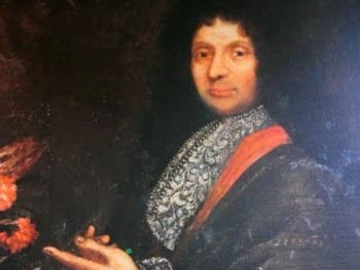 Portrait of a man in historical attire with curly hair.