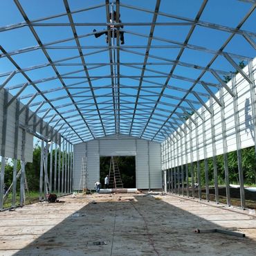 Durable man size steel frame building used for storage, RV carport, workshops with NY snow loads.