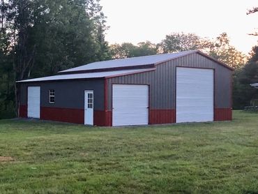 12' tall oversized steel structure is near me in Newport,NY. It has an enclosed lean with two tone s