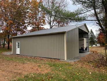 38x36x14 custom steel structure near Gloversville,NY in Fulton County is being used as RV carport.