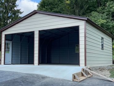 Pre-engineered high quality residential metal garage on concrete pad in Cortland, County, N.Y.