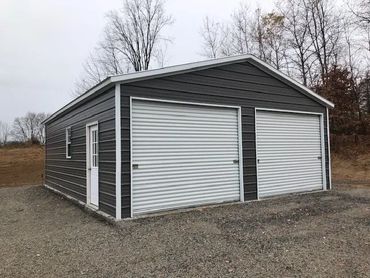 Horizontal siding on residential 2 car garage is affordable in Rome,NY available in Oneida County