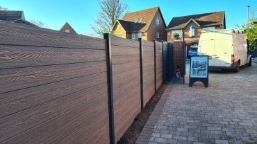 composite fencing in gray with galvanised and powder coated steel posts