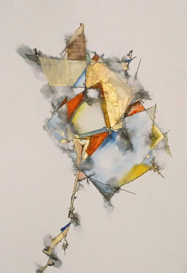 Abstract geometric shapes in muted colors with smoky edges on a white background.