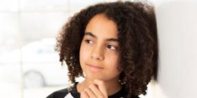 A headshot of one of our kid Brand Ambassador's, looking pensive.