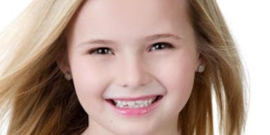 A headshot of a Talk to the Camera Brand Ambassador Kiddos, she's smiling.