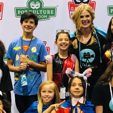 Brand Ambassadors and Audrey Walters on stage at Pop Culture Con. In costumes or our brand Tees.