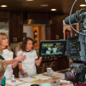 Co-Founders, Audrey Walters and Jenny Gilbert, talking to instructors while being filmed.