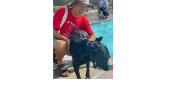 happy customer with an active labrador pup