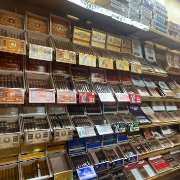 Display shelves filled with various cigar boxes.