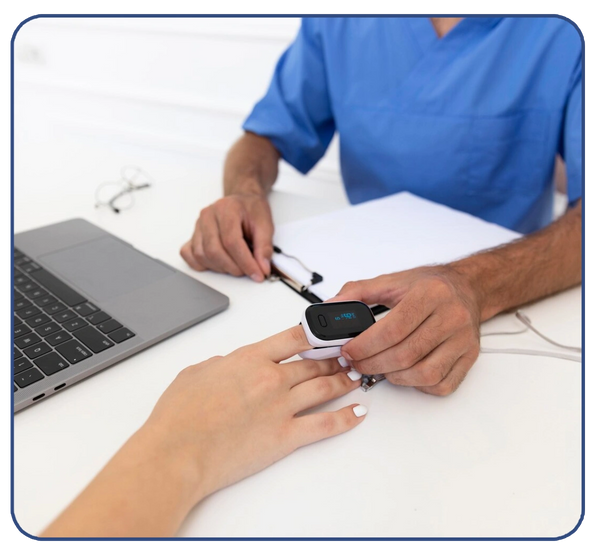 Healthcare professional measures patient's oxygen level with a pulse oximeter.