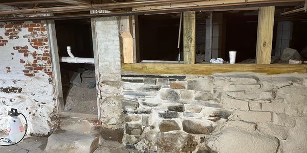 Rubble foundation with added structural posts