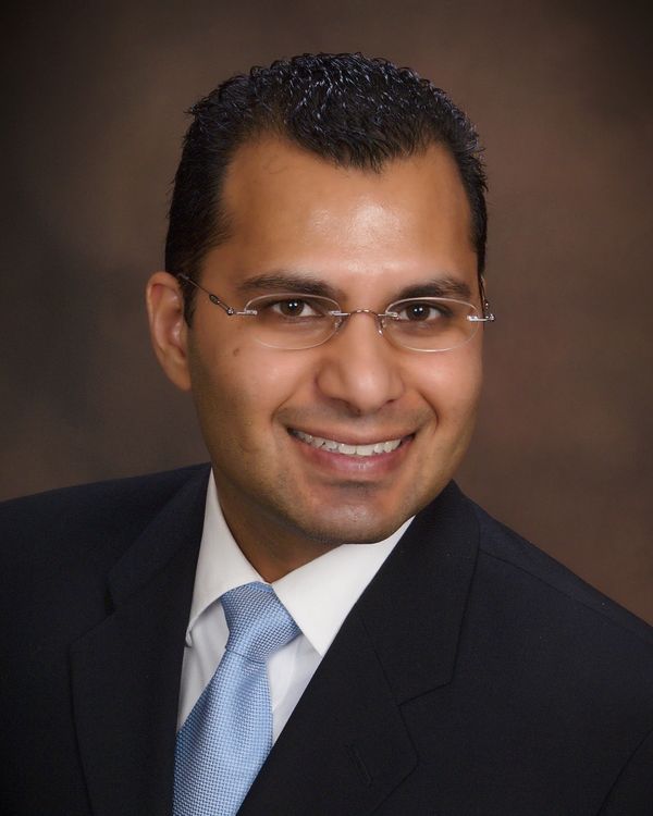 Headshot photo of Neeraj Shah, Esq., MBA, CPA. Neeraj Shah is a CPA and attorney.