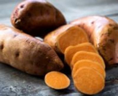 whole and sliced sweet potatoes