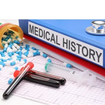 Medical history file with pills, blood samples, and syringe on a medical chart.