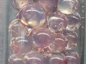 When pulled into a thin stringer, it would change to a translucent pink. It would devitrify like EDP