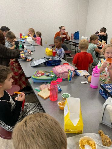The elementary students enjoying lunch.