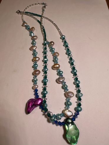 Assorted size and colors of freshwater pearl necklaces.