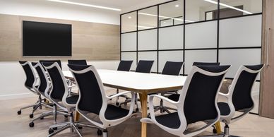 Boardroom designed to show mediation or facilitation setting