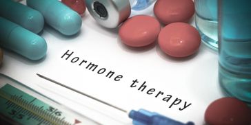 Various pills and a syringe with 'Hormone therapy' text.