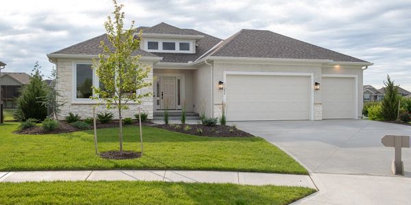 Modern single-story house with a three-car garage.