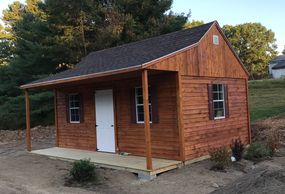 New shed is in place, building has been wired and stained as well as shrubs have been planted.