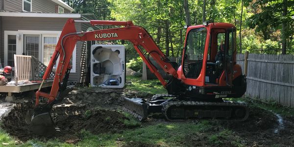 Excavator digging a 24' dia hole for a pool install
excavating contractor, Atkinson NH 