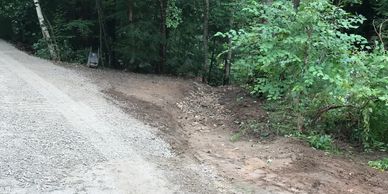 Swale has been installed at the top of this gravel driveway to redirect the flow of water coming in 
