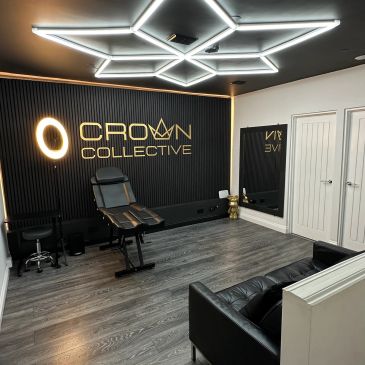 Modern tattoo studio with sleek design and neon lighting.