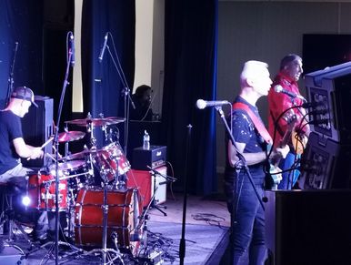 James, Taj and Gerard on stage performing