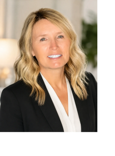 Professional woman with blonde hair in business attire.