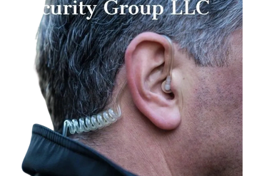 Close-up of a man wearing a clear coiled security earpiece.