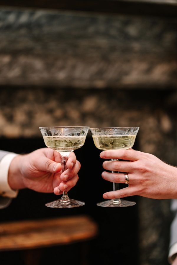 Cheering of champagne glasses after a micro wedding