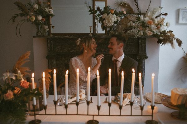 A joyful couple shares a romantic moment at their micro-wedding reception in Philadelphia