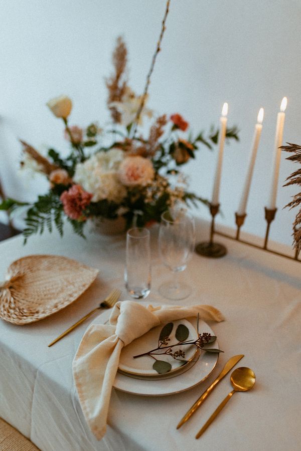 Dinner table with gold silverware at Vaux Studio
